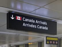 A "Canada Arrivals" sign.