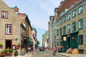 A street in Quebec with stone buildings on either side.