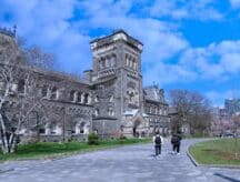 Students outside a Gothic-style university building