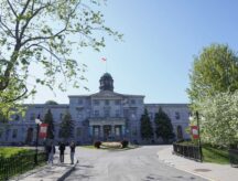 Three students walk in front of McGill University.