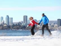 Couple enjoying the snowy weather of Montreal on a bright winter day