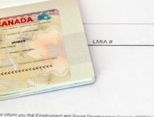 A picture of a Canadian visa above an application for a Labour Market Impact Assesment.