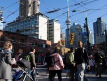 People walking on a busy street in Downtown Toronto