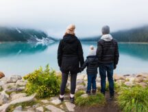 A picture of a family visiting a lake at Banff national park.