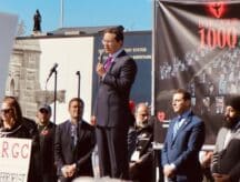 Pierre Poilievre speaks to a crowd of people.